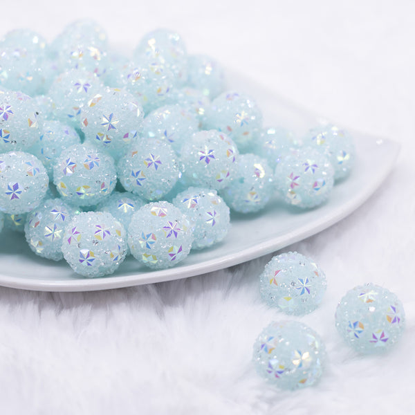 front view of a pile of 16mm Blue Snowflake luxury acrylic beads