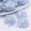 close up view of a pile of 16mm Blue with Pearls luxury acrylic beads
