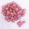 top view of a pile of 16mm Bright Pink Cats Eye Acrylic Bubblegum Beads