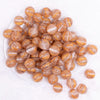 top view of a pile of 16mm Gold Cats Eye Acrylic Bubblegum Beads