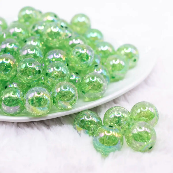 front view of a pile of 16mm Green Crackle AB Bubblegum Beads