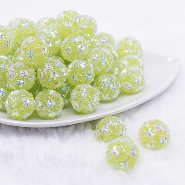 front view of a pile of 16mm Green Snowflake luxury acrylic beads