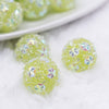 close up view of a pile of 16mm Green Snowflake luxury acrylic beads