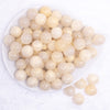 top view of a pile of 16mm Ivory Luster Bubblegum Beads