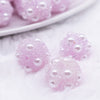 Close up view of a pile of 16mm Light Purple with pearls luxury acrylic beads