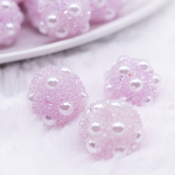 Close up view of a pile of 16mm Light Purple with pearls luxury acrylic beads