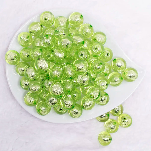 top view of a pile of 16mm Lime Green Foil Bubblegum Beads