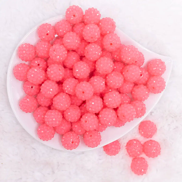 top view of a pile of 16mm Neon Pink with Clear Rhinestone Bubblegum Beads