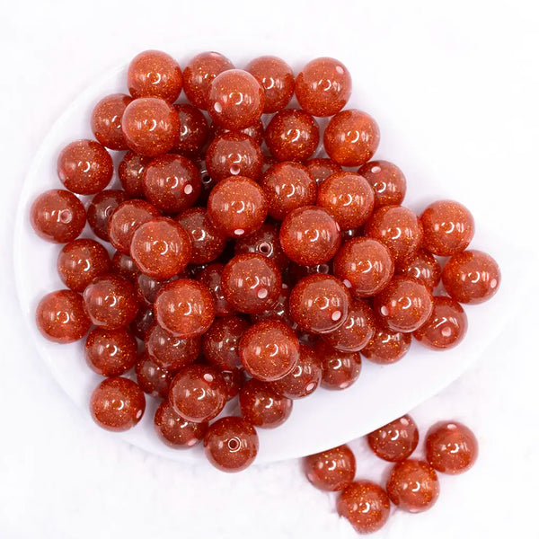 top view of a pile of 16mm Orange Glitter Sparkle Bubblegum Beads