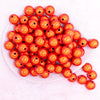 top view of a pile of 16mm Orange Miracle Bubblegum Bead