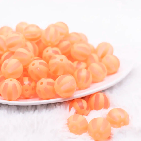 front view of a pile of 16MM Orange Frosted Beach Ball Bubblegum Beads
