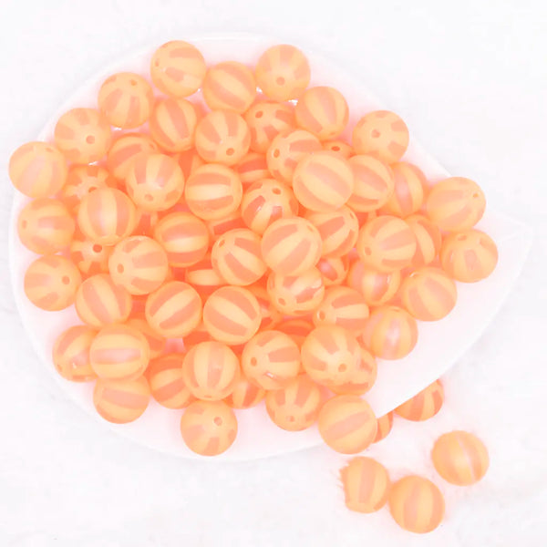 top view of a pile of 16MM Orange Frosted Beach Ball Bubblegum Beads