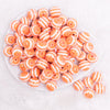 top view of a pile of 16MM Orange with AB Stripes Bubblegum Beads