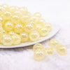 front view of a pile of 16mm Pastel Yellow Crackle AB Bubblegum Beads