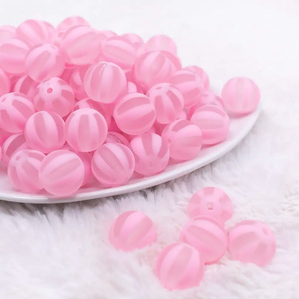 front view of a pile of 16MM Pink Frosted Beach Ball Bubblegum Beads