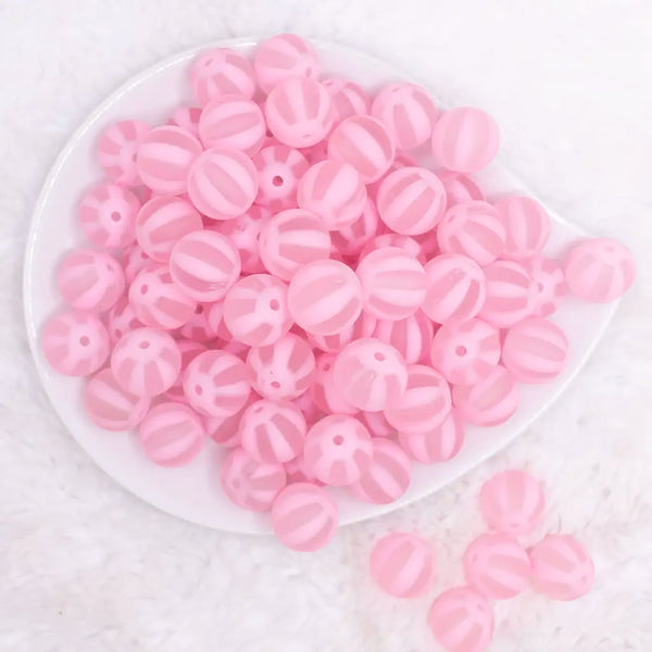 top view of a pile of 16MM Pink Frosted Beach Ball Bubblegum Beads