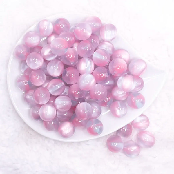 top view of a pile of 16mm Pink Illusion Glitter Bubblegum Bead