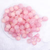 top view of a pile of 16mm Pink Luster Bubblegum Beads