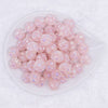 top view of a pile of 16mm Pink Snowflake luxury acrylic beads