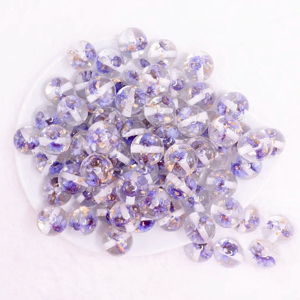 top view of a pile of 16mm Purple Flaked Flower Bubblegum Bead