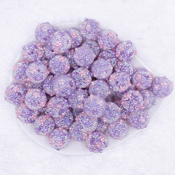top view of a pile of 16mm Purple with Pearls luxury acrylic beads