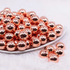 front view of a pile of 16mm Reflective Rose Gold Acrylic Bubblegum Beads