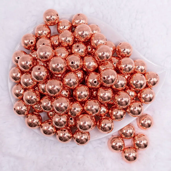 top view of a pile of 16mm Reflective Rose Gold Acrylic Bubblegum Beads