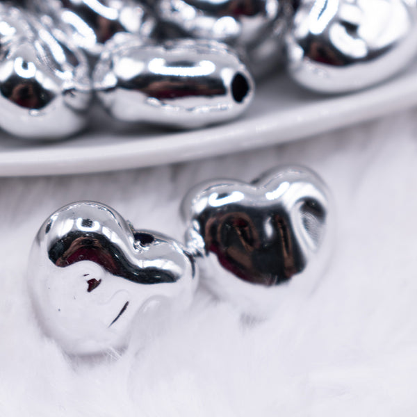 close up view of a pile of 18mm Silver Chrome Heart Acrylic Bubblegum Beads