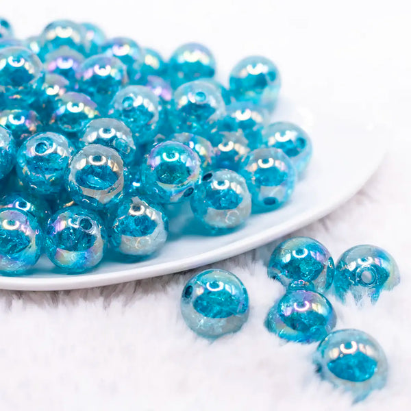 front view of a pile of 16mm Teal Blue Crackle AB Bubblegum Beads