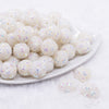 front view of a pile of 16mm White Snowflake luxury acrylic beads