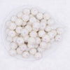 top view of a pile of 16mm White Snowflake luxury acrylic beads
