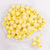 top view of a pile of 16MM Yellow with AB Stripes Bubblegum Beads