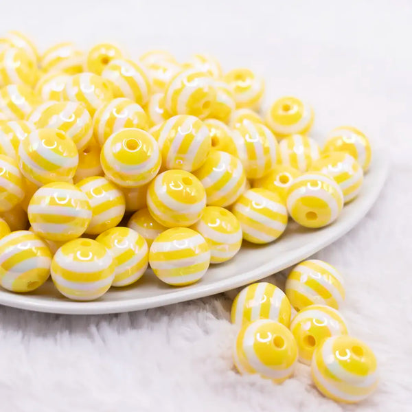front view of a pile of 16MM Yellow with AB Stripes Bubblegum Beads
