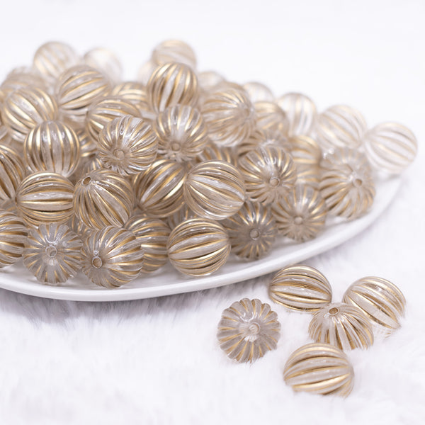 front view of a pile of 16mm Gold antique Bubblegum Beads