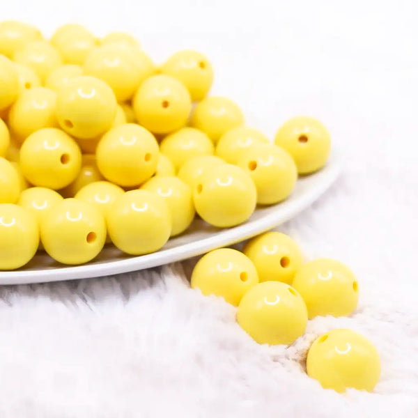front view of a pile of 16mm Yellow Solid Bubblegum Beads