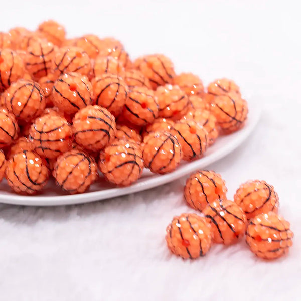 front view of a pile of 16mm Basketball with Clear Rhinestone Bubblegum Beads