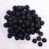 top view of a pile of 16mm Black Sequin Confetti Bubblegum Beads