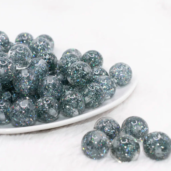 front view of a pile of 16mm Black Glitter Twinkle Bubblegum Beads