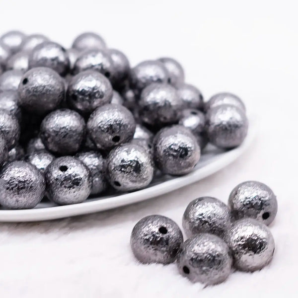 front view of a pile of 16mm Black Crinkle Foil Bubblegum Beads