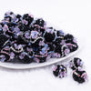 front view of a pile of Copy of 20mm Black luxury acrylic beads with iridescent butterfly accents