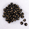 top view of a pile of 16mm Black with Gold Paisley luxury acrylic beads