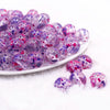 front view of a pile of 16mm Purple and Hot Pink Splatter Bubblegum Bead