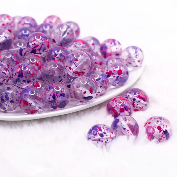 front view of a pile of 16mm Purple and Hot Pink Splatter Bubblegum Bead