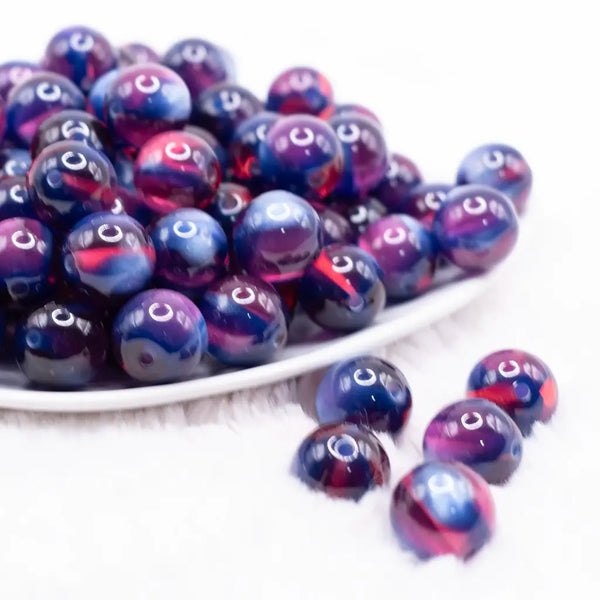 front view of a pile of 16mm Blue and Red Illusion Glitter Bubblegum Bead