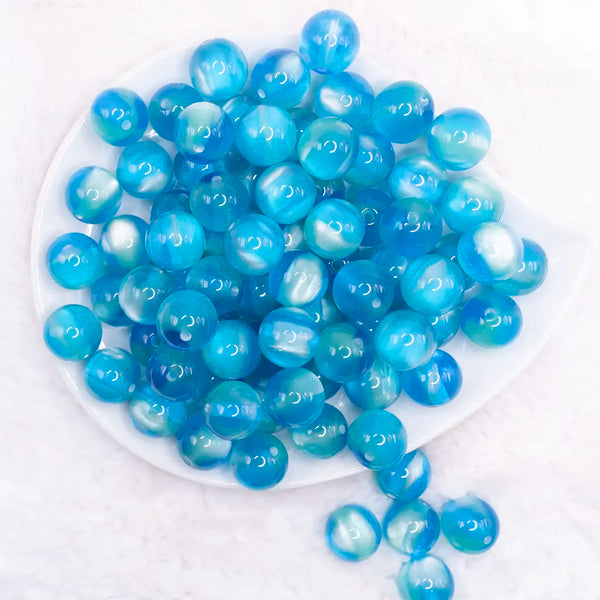 top view of a pile of 16mm Blue Illusion Glitter Bubblegum Bead