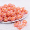 front view of a pile of 16mm Bright Orange Rhinestone AB Chunky Bubblegum Jewelry Beads