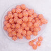 top view of a pile of 16mm Bright Orange Rhinestone AB Chunky Bubblegum Jewelry Beads
