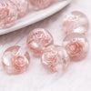 macro view of a pile of 16mm Champagne Gold Rose Bubblegum Beads