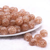 front view of a pile of 16mm Champagne Gold Glitter Twinkle Bubblegum Beads