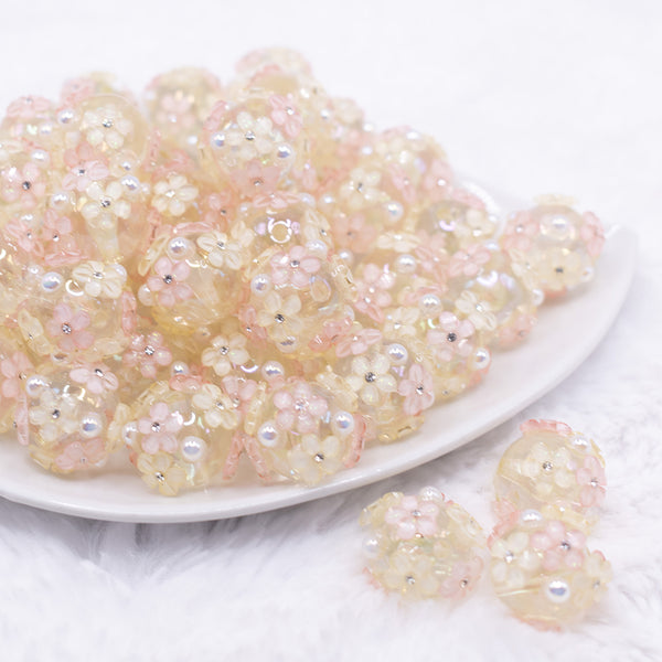 front view of a pile of 16mm Clear Floral Bliss luxury acrylic beads